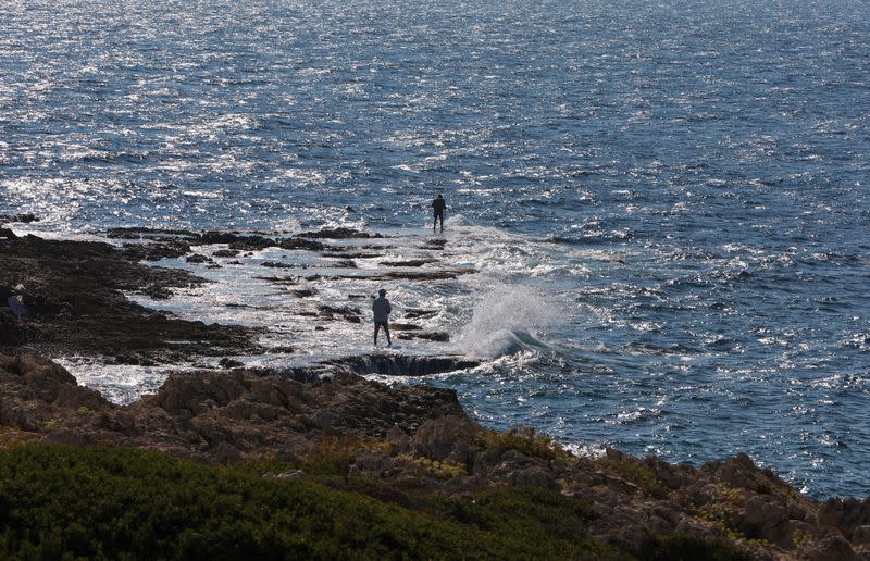 FILE PHOTO: Fishermen catch fish in Naqoura