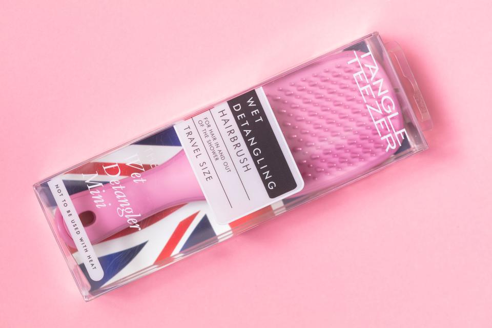 London, United Kingdom - April 8, 2021: Pink Tangle Teezer Mini on pink background