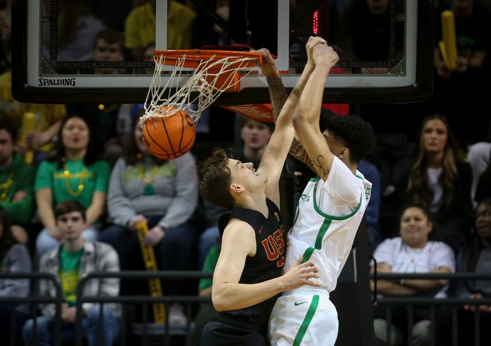 Oregon center Kel'el Ware dunks the ball as the Oregon Ducks host the Southern California Trojans Thursday, Feb. 9, 2023, at Matthew Knight Arena in Eugene, Ore.