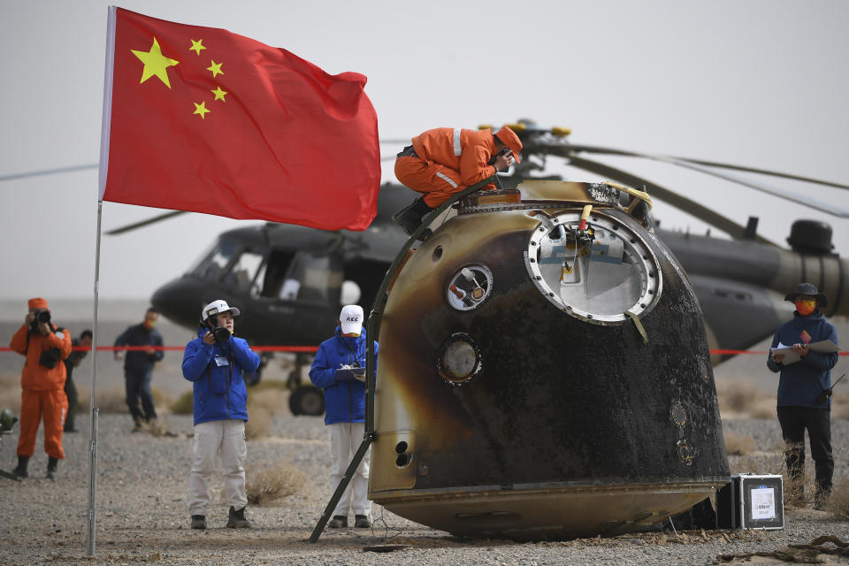 FILE - In this photo released by China's Xinhua News Agency, the return capsule of the Shenzhou-13 manned space mission is seen after landing at the Dongfeng landing site in northern China's Inner Mongolia Autonomous Region, April 16, 2022. Three Chinese astronauts returned to Earth on Saturday after six months aboard China's newest space station in the longest crewed mission to date for its ambitious space program. It’s not just rocket fuel propelling America’s first moonshot after a half-century lull. Rivalry with China’s space program is helping drive NASA’s effort to get back into space in a big way. That's as both nations push to put people back on the moon and establish the first lunar bases. (Peng Yuan/Xinhua via AP, File)