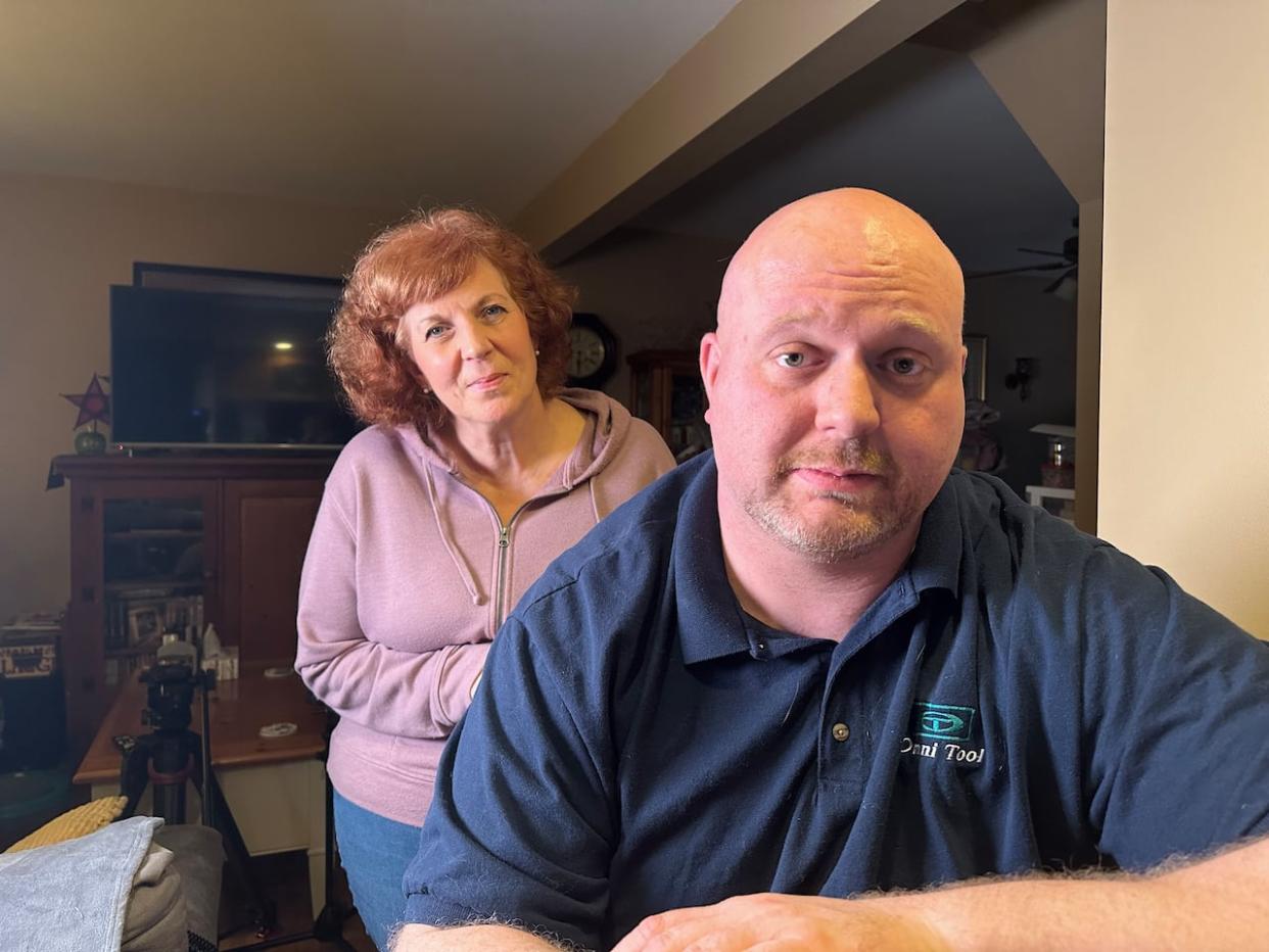 Michael Portman, right, and his mom, Wendy Portman, say they are frustrated by the process to deal with tenants and want it to be over with.  (Jennifer La Grassa/CBC - image credit)