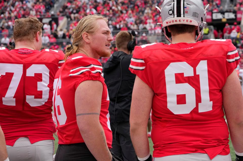 Harry Miller, left, talks to offensive lineman Jack Forsman during Ohio State's spring game in 2022.