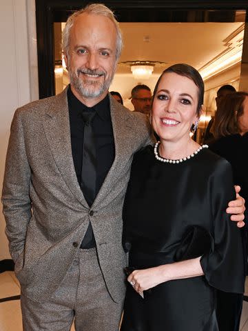 <p>Dave Benett/ Getty</p> Ed Sinclair and Olivia Colman attend the Harper's Bazaar Women of the Year Awards 2023 on November 7, 2023 in London, England.