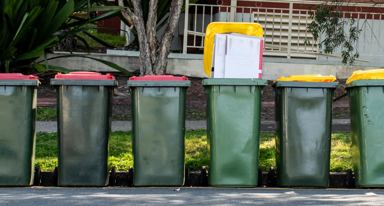 Three red bins and three yellow bins