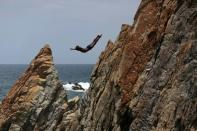 A cliff diver jumps at La Quebrada in Acapulco, Mexico