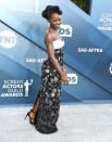 Lupita was effortlessly chic in her strapless monochrome gown by Louis Vuitton, which featured a floral pattern skirt and white bust panel. [Photo: Getty]