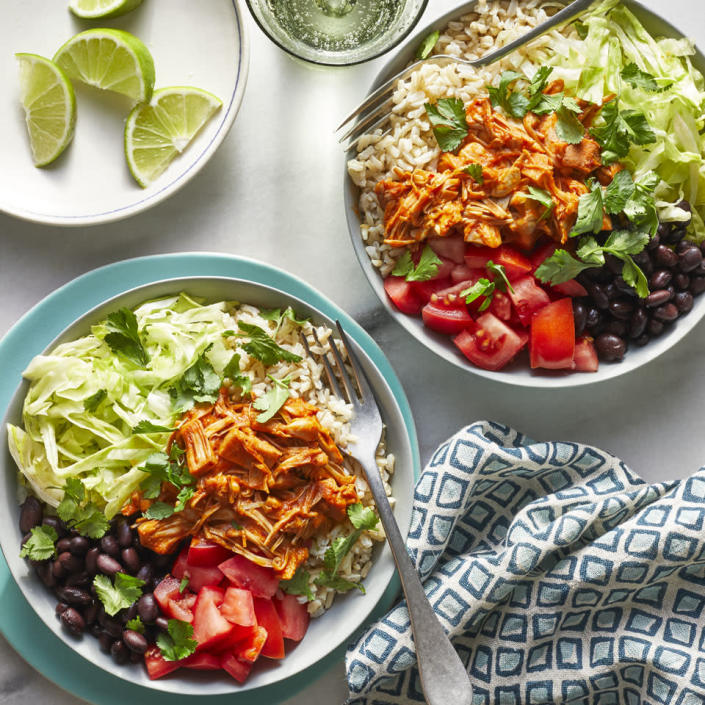 <p>Jackfruit, a tropical fruit with a dense, chewy texture, is a blank canvas that takes on flavors well. In these vegan burrito bowls, the jackfruit is simmered in a warm and spicy chile sauce that's so good you'll never know you're eating a plant-based protein instead of pork or beef. <a href="https://www.eatingwell.com/recipe/271031/jackfruit-barbacoa-burrito-bowls/" rel="nofollow noopener" target="_blank" data-ylk="slk:View Recipe" class="link ">View Recipe</a></p>