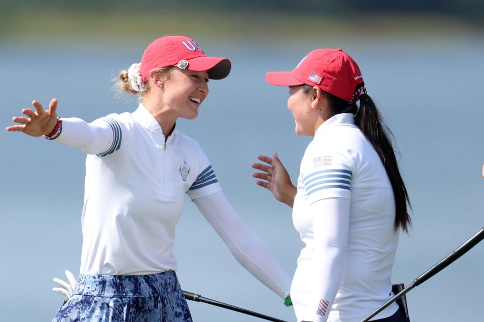 GAINESVILLE, VIRGINIA - SEPTEMBER 14: Allisen Corpuz and Nelly Korda of Team United States react on the 18th green after winning their match during the Saturday Foursomes matches against Team Europe during the second round of the Solheim Cup 2024 at Robert Trent Jones Golf Club on September 14, 2024 in Gainesville, Virginia. (Photo by Gregory Shamus/Getty Images)