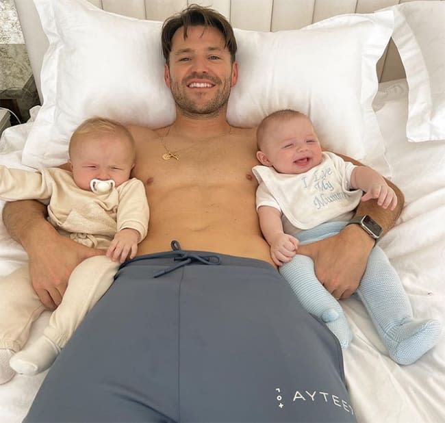 Mark Wright with two babies