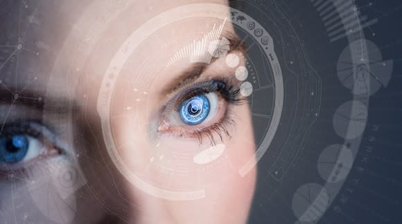 A woman wears a smart contact lens.