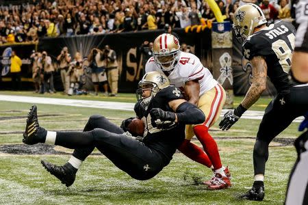 Nov 9, 2014; New Orleans, LA, USA; New Orleans Saints tight end Jimmy Graham (80) catches the ball in front of San Francisco 49ers strong safety Antoine Bethea (41) but is flagged for offensive pass interference negating a touchdown on the final play in the fourth quarter at Mercedes-Benz Superdome. The 49ers won 27-24 in overtime. Mandatory Credit: Derick E. Hingle-USA TODAY Sports