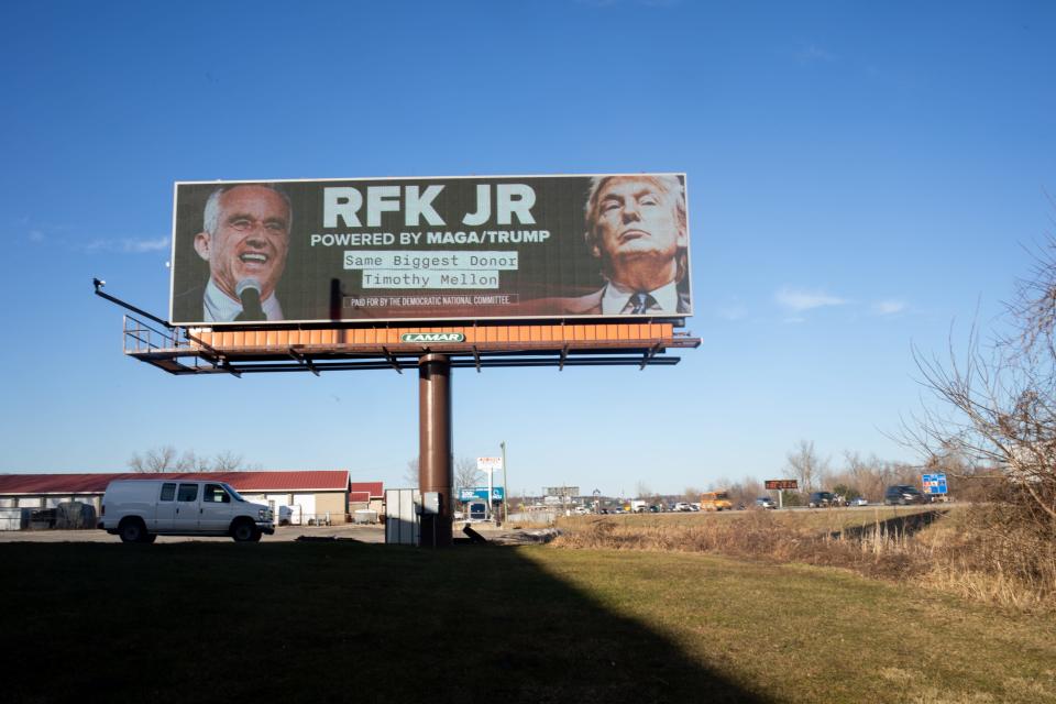 A billboard sponsored by the Democratic National Committee highlights billionaire Timothy Mellon's support for super PACs for both Robert F. Kennedy Jr. and former President Donald Trump.