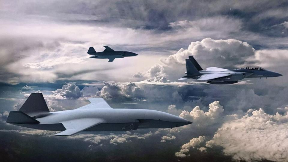 A conceptual design of low-cost, attritable drones serving as wingmen for a crewed fighter jet. (U.S. Air Force)