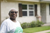 Doris Brown poses for a photograph outside her home Friday, July 31, 2020, in Houston. Brown's home flooded during Harvey and she's part of a group called the Harvey Forgotten Survivors Caucus. (AP Photo/David J. Phillip)