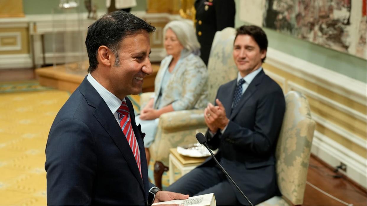 Minister of Justice and Attorney General of Canada Arif Virani takes the oath of office as Prime Minister Justin Trudeau looks on during a cabinet swearing-in ceremony at Rideau Hall in Ottawa on Wednesday, July 26, 2023. (Adrian Wyld/The Canadian Press - image credit)