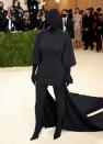 <p> Arriving with then-husband Kanye West, Kim Kardashian's look at the 2021 Met Gala made huge media waves. The blackout gown was one-of-a-kind and left the reality star covered from head to toe in a black jersey material. It was designed by Balenciaga's creative director Demna Gvasalia. </p>