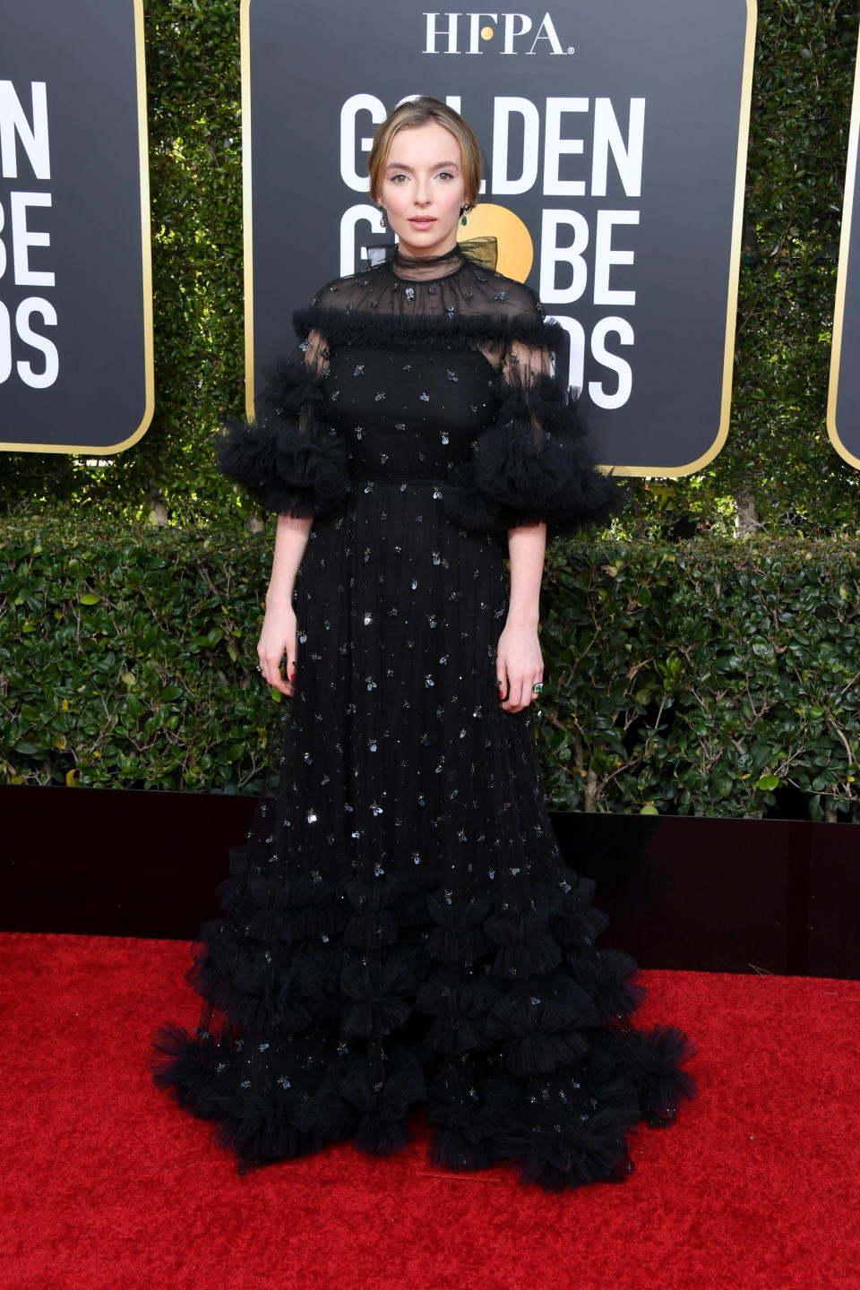 <p>Jodie Comer chose a ruffled Ralph and Russo dress Villanelle would be proud of for this year’s Golden Globe Awards. <em>[Photo: Getty]</em> </p>