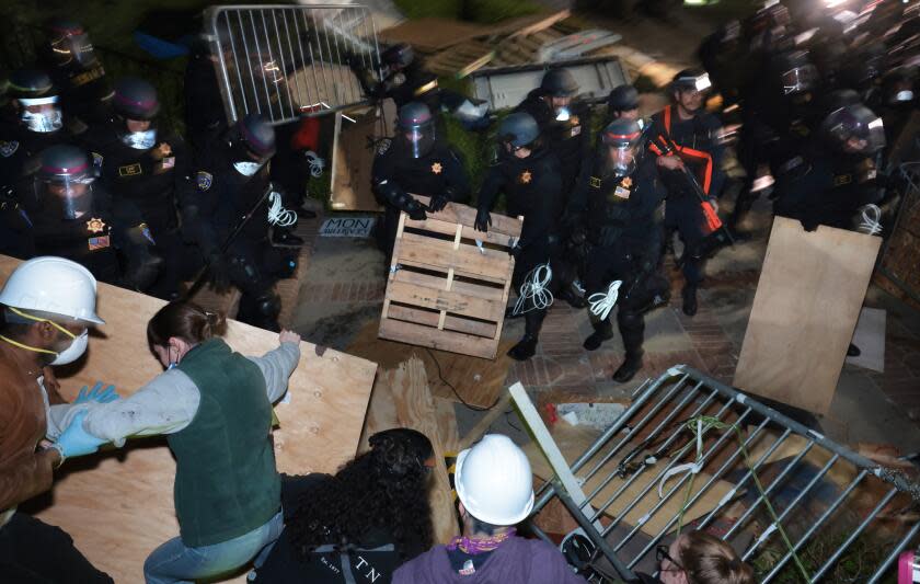 LOS ANGELES, CALIFORNIA - May 2: Police clash with pro-Palestinian protesters after an oder to disperse was given at UCLA early Thursday morning. (Wally Skalij/Los Angeles Times)