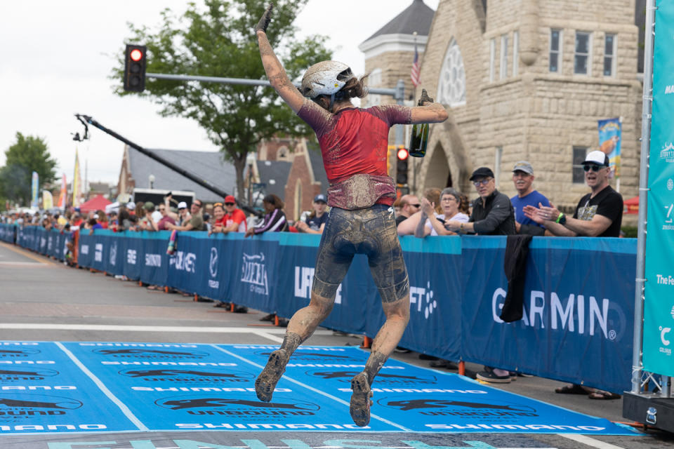 Jumping for joy. Sofia Gomez Villafane celebrates her win at the Unbound finish line.