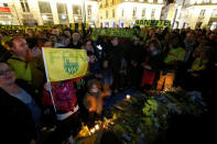 Fans gather near a row of yellow tulips in Nantes' city center after news that newly-signed Cardiff City soccer player Emiliano Sala was missing after the light aircraft he was travelling in disappeared between France and England the previous evening, according to France's civil aviation authority, France, January 22, 2019. REUTERS/Stephane Mahe