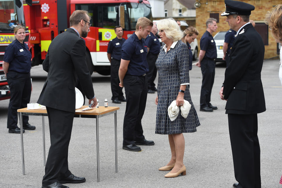 The Duchess of Cornwall meets firefighters, staff from Great Western Hospital and paramedics from South Western Ambulance Service during a visit to Swindon Fire Station in Wiltshire.