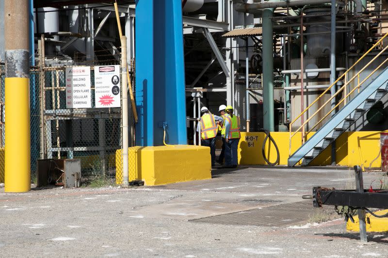 Workers are seen at the Costa Sur power plant after an earthquake in Guayanilla
