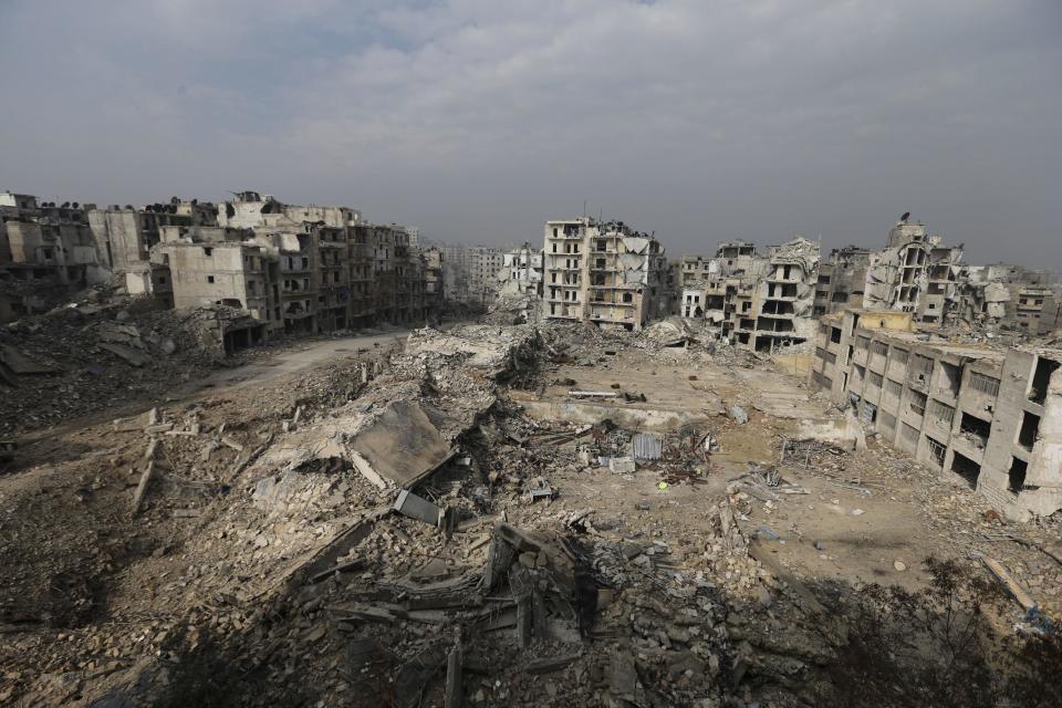 In this Friday, Jan. 20, 2017 photo, mounds of rubble remain from what used to be high rise apartment buildings in the once rebel-held Ansari neighborhood of eastern Aleppo, Syria. Aleppo, Syria’s largest city, was widely brought to ruin by years of war, and now with Russia and Turkey leading peace efforts, international officials say it is time to start talking about rebuilding Aleppo and other cities. But there are few answers on how to do it, with the world reluctant to donate the billions needed and a political settlement in the war still uncertain and far off. (AP Photo/Hassan Ammar)