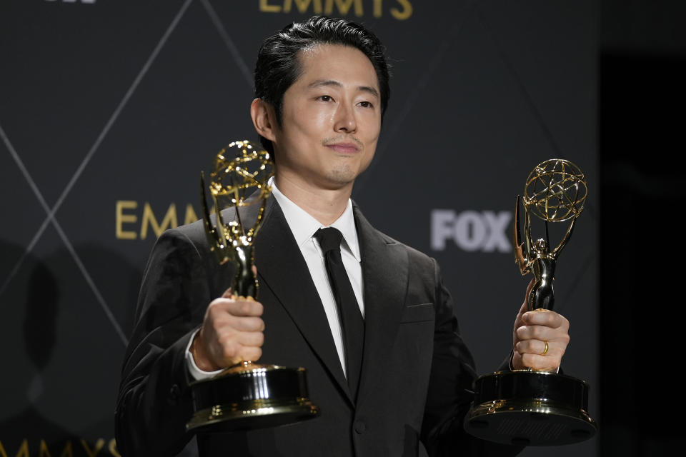 Steven Yeun, winner of the awards for outstanding lead actor in a limited or anthology series or movie and outstanding limited or anthology series for "Beef," poses in the press room during the 75th Primetime Emmy Awards on Monday, Jan. 15, 2024, at the Peacock Theater in Los Angeles. (AP Photo/Ashley Landis)