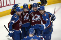 Colorado Avalanche right wing Valeri Nichushkin (13) celebrates his goal against the Tampa Bay Lightning with right wing Mikko Rantanen (96) defenseman Josh Manson (42) and defenseman Bowen Byram (4) during the second period in Game 2 of the NHL hockey Stanley Cup Final, Saturday, June 18, 2022, in Denver. (AP Photo/David Zalubowski)