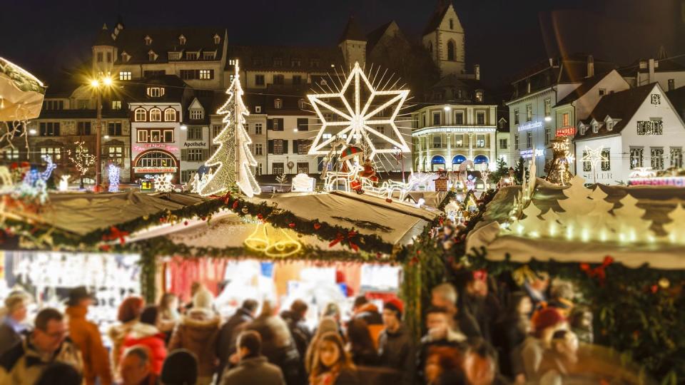 christmas market in the old town of basel, one of the largest and populated cities of switzerland it is located in the northwest of the country, on river rhine and right on the swiss french german border