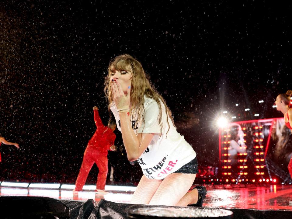 Taylor Swift blows a kiss while performing at the Eras Tour.