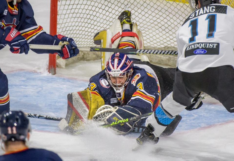 Peoria goalie Eric Levine dives onto the puck during the third period Friday, Jan. 21, 2022 at Carver Arena. The Rivermen defeated the Quad City Storm 3-2 in sudden-death overtime.