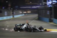 Mercedes driver Lewis Hamilton of Britain steers his car during the qualifying round for the Singapore Formula One Grand Prix at the Marina Bay City Circuit in Singapore, Saturday, Sept. 21, 2019. (AP Photo/Vincent Thian)