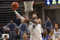 Villanova guard Justin Moore (5) makes a layup during the first half of an NCAA college basketball game against Seton Hall, Tuesday, Jan. 19, 2021, in Villanova, Pa. (AP Photo/Laurence Kesterson)