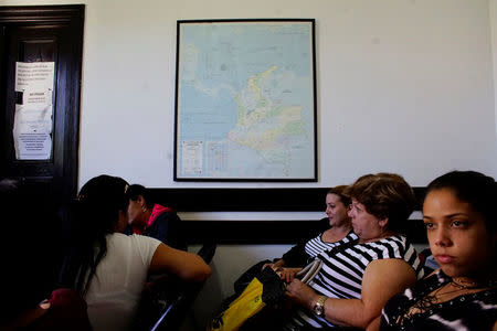 People wait for their turn inside the Colombian Embassy in Havana, Cuba, January 11, 2018. REUTERS/Alexandre Meneghini