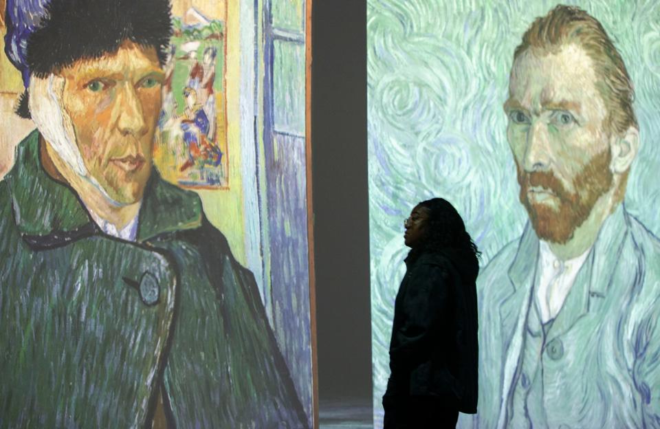 Members of the media walk through Beyond Van Gogh: The Immersive Experience during a media preview on Thursday, March 24, 2022, at the Graceland Exhibition Center. The exhibit will open March 25. 