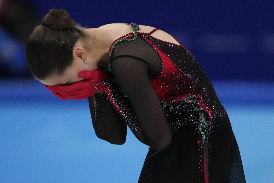 Kamila Valieva, of the Russian Olympic Committee, reacts after the women's free skate program during the figure skating competition at the 2022 Winter Olympics, Thursday, Feb. 17, 2022, in Beijing. (AP Photo/Bernat Armangue)