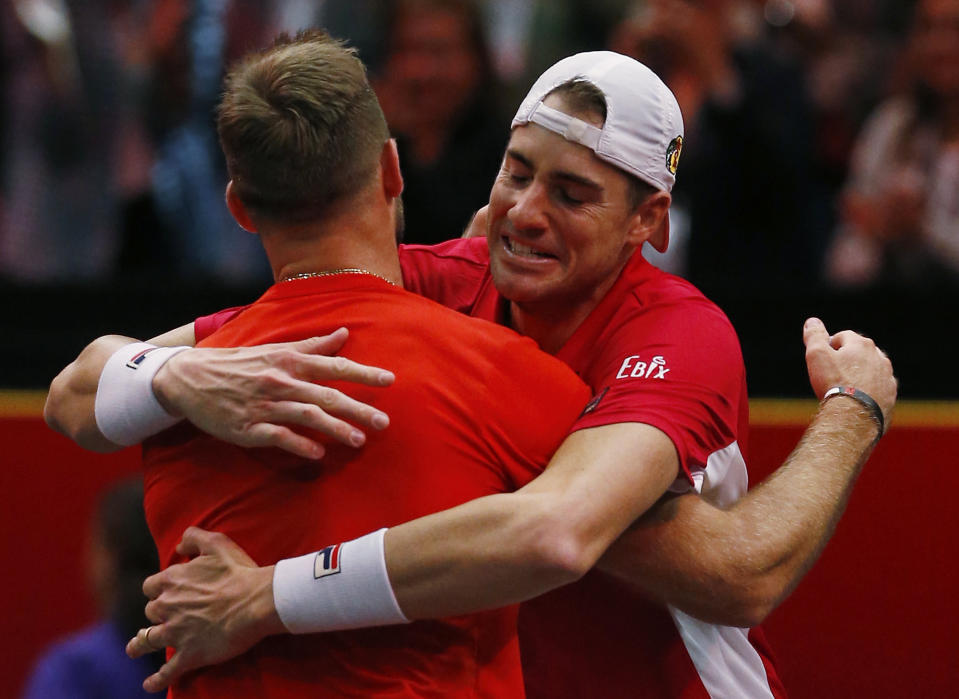 Team World's John Isner, right, and Jack Sock celebrate their win over Team Europe's Roger Federer and Alexander Zverev in a men's doubles tennis match at the Laver Cup, Sunday, Sept. 23, 2018, in Chicago. (AP Photo/Jim Young)