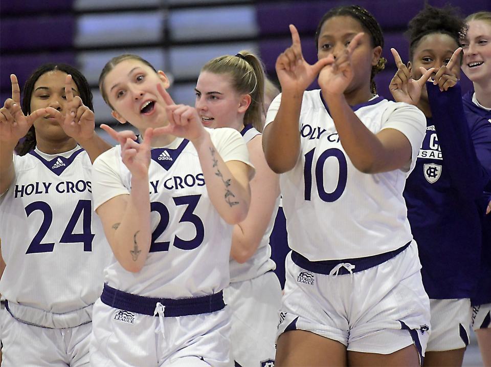 Holy Cross players celebrate their Patriot League opener win over Bucknell.