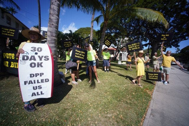 Demonstrators opposed a bill to mandate 90-day minimum stays in residential rental properties when it came before the City Council. Now several neighborhood organizations are fighting to keep the 90-day minimum in the face of a legal challenge filed in federal court by an association of property owners.