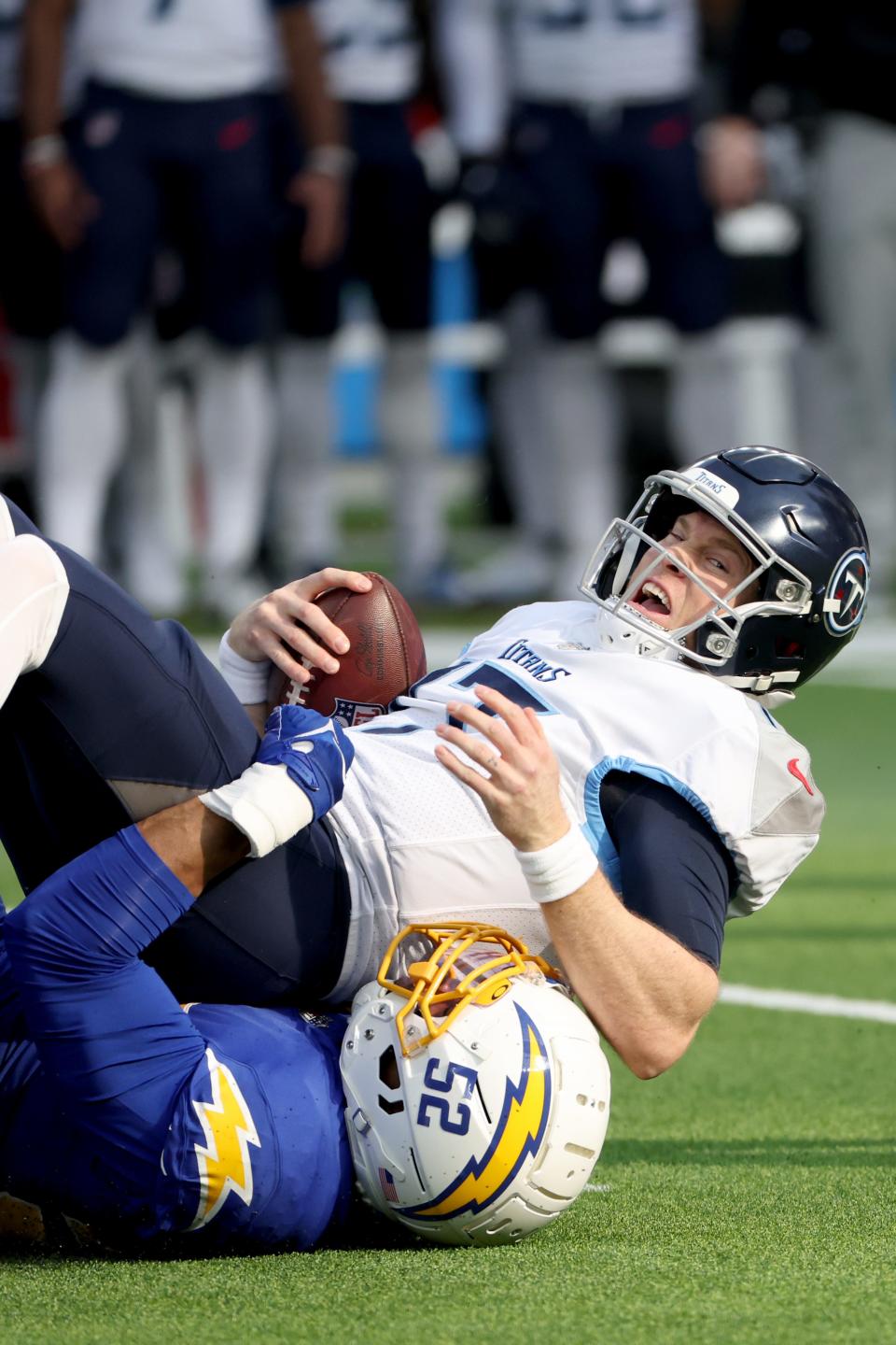 Tennessee Titans quarterback Ryan Tannehill (17) is sacked by Los Angeles Chargers linebacker Khalil Mack (52) during the first half of the NFL game at SoFi Stadium on Dec. 18, 2022; Inglewood, California, USA.