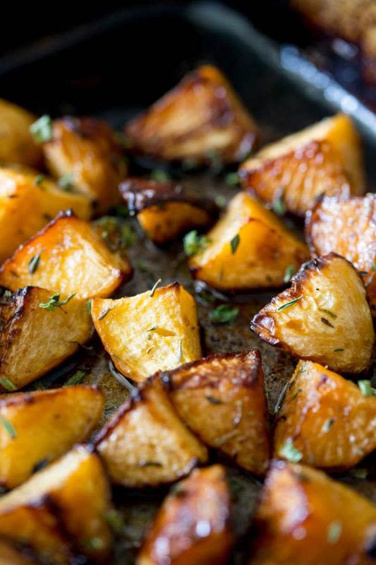 <p>Sprinkles and Sprouts</p><p>This roasted rutabaga recipe is a wonderful addition to your dinner table. The rutabaga is roasted in the oven and then finished with maple syrup to give it a wonderful crunch and sweetness.</p><p><strong>Get the recipe: <a href="https://www.sprinklesandsprouts.com/roasted-swede-maple-syrup-thyme/" rel="nofollow noopener" target="_blank" data-ylk="slk:Roasted Rutabaga with Maple Syrup;elm:context_link;itc:0;sec:content-canvas" class="link rapid-noclick-resp"><em>Roasted Rutabaga with Maple Syrup</em></a></strong></p>