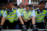 <p>Police monitor pro-independence activists taking part in a march marking the 20th anniversary of Hong Kong’s handover to Chinese sovereignty from British rule, in Hong Kong, China, July 1, 2017. (Photo: Damir Sagolj/Reuters) </p>