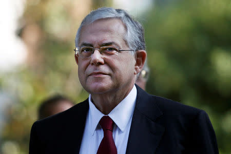 FILE PHOTO: Greece's incoming Prime Minister Lucas Papademos is seen after a meeting with Greek political leaders outside the Presidential palace in Athens, Greece, November 10, 2011. REUTERS/Yannis Behrakis/File photo