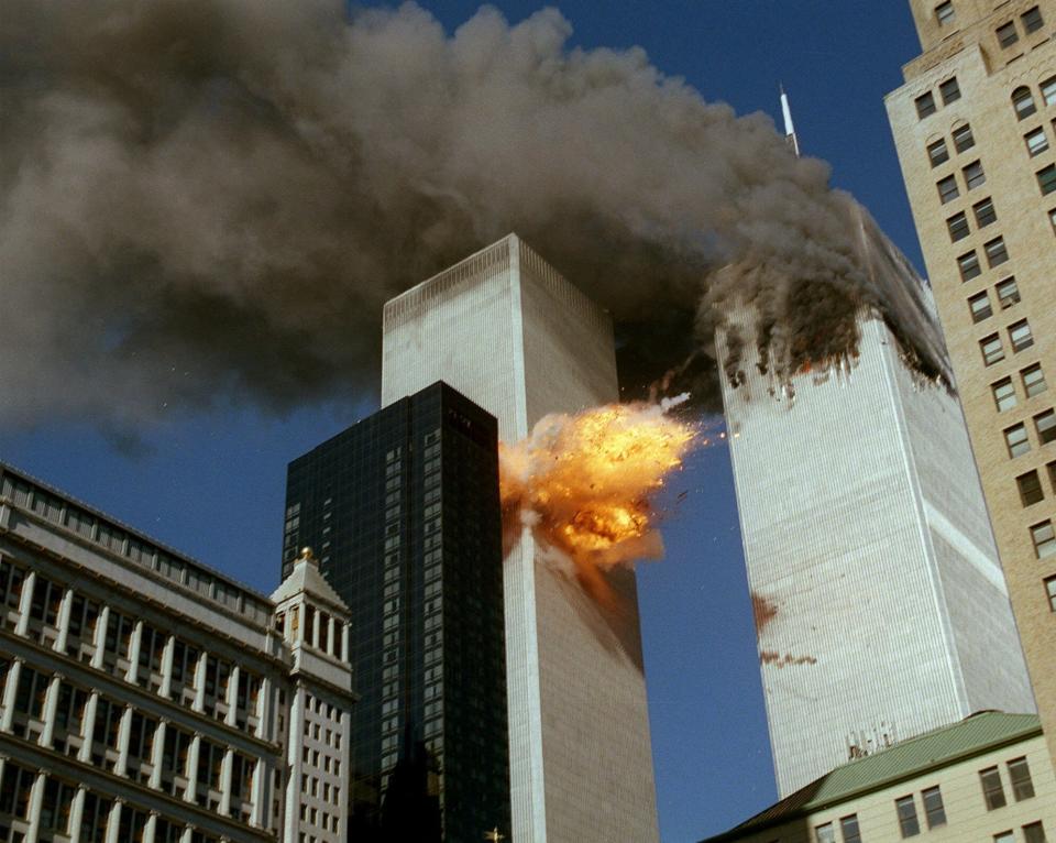 ORG XMIT: NY403 FILE - In this Sept. 11, 2001 file photo, United Airlines Flight 175 collides into the south tower of the World Trade Center in New York as smoke billows from the north tower.