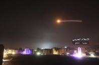 <p>This photo provided early Thursday, May 10, 2018, by the government-controlled Syrian Central Military Media, shows missiles rise into the sky as Israeli missiles hit air defense position and other military bases, in Damascus, Syria. (Photo: Syrian Central Military Media, via AP) </p>