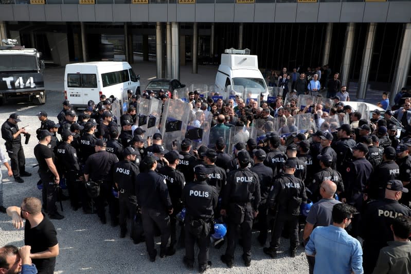 FILE PHOTO: Pro-Kurdish HDP lawmakers are surrounded by riot police as they protest against detention of their local politicians in Diyarbakir