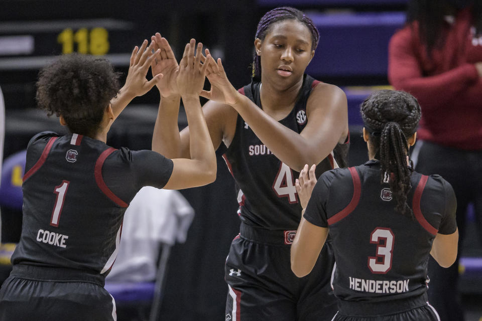 South Carolina forward Aliyah Boston (4) is introduced with teammates South Carolina guard Zia Cooke (1) and South Carolina guard Destanni Henderson (3) at an NCAA basketball game against LSU in Baton Rouge, La., Sunday, Jan. 24, 2021. (AP Photo/Matthew Hinton)