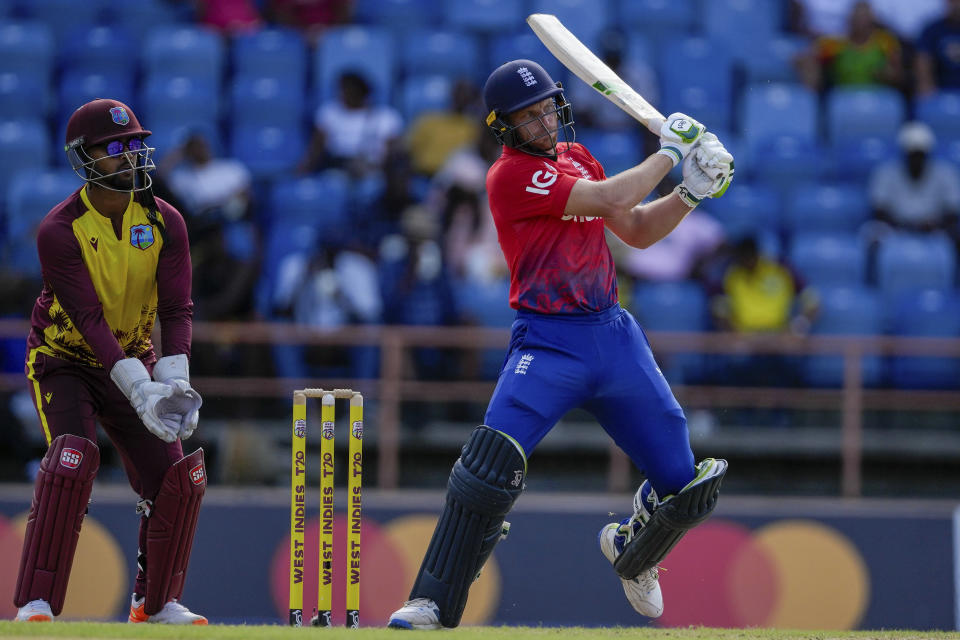 England's captain Jos Buttler plays a shot against West Indies during the third T20 cricket match at National Cricket Stadium in Saint George's, Grenada, Saturday, Dec. 16, 2023. (AP Photo/Ricardo Mazalan)