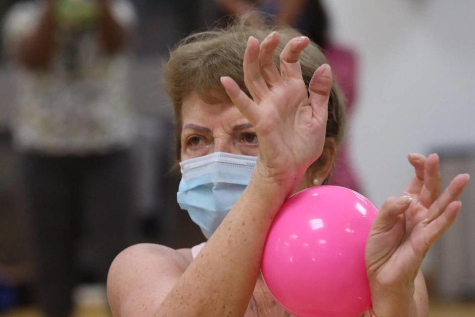 Elma Hamblet Bastien stretches with a ball during the SilverSneakers fitness classes through some Medicare programs at the Alper Jewish Community Center in Kendall.
